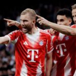 هاري كين وأوليسي خلال مباراة لبايرن ميونخ في دوري أبطال أوروبا