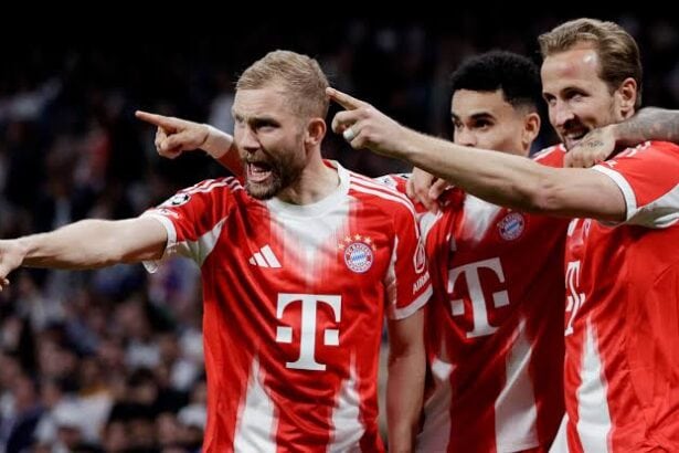 هاري كين وأوليسي خلال مباراة لبايرن ميونخ في دوري أبطال أوروبا